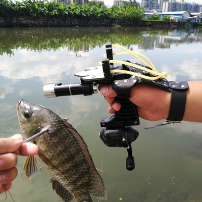 Fishing slingshot with reel and dart